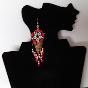 Handmade beaded guichol earrings in the shape of a waterfall.